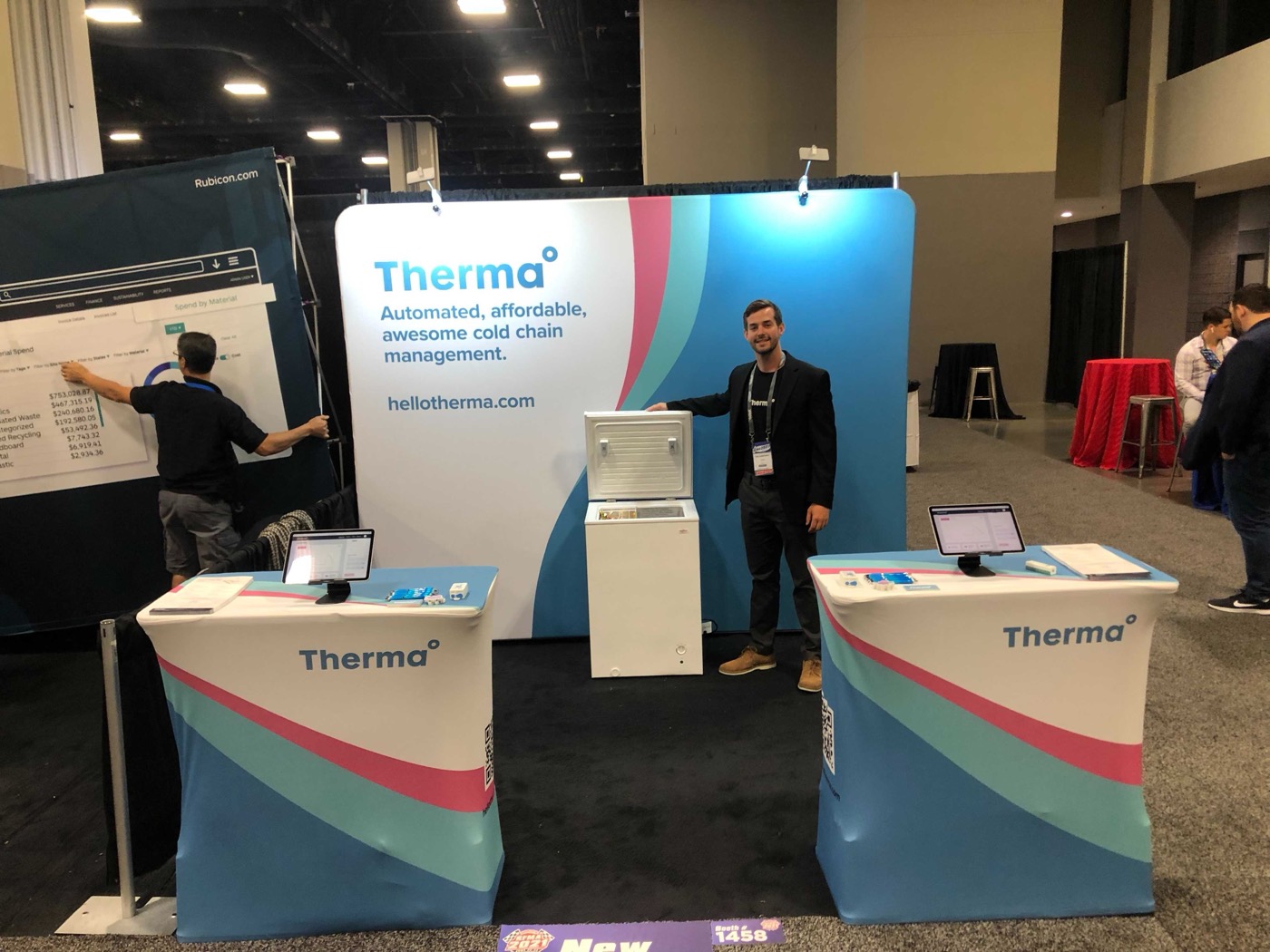 The Therma trade show booth on a large convention floor with a walk-in cooler display.
